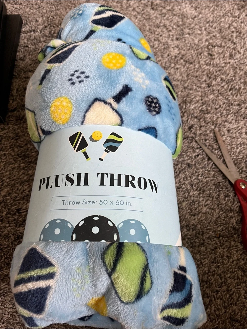 Plush Throw Blanket in Light Blue with pickleball. Polyester. New. 50x60. New.